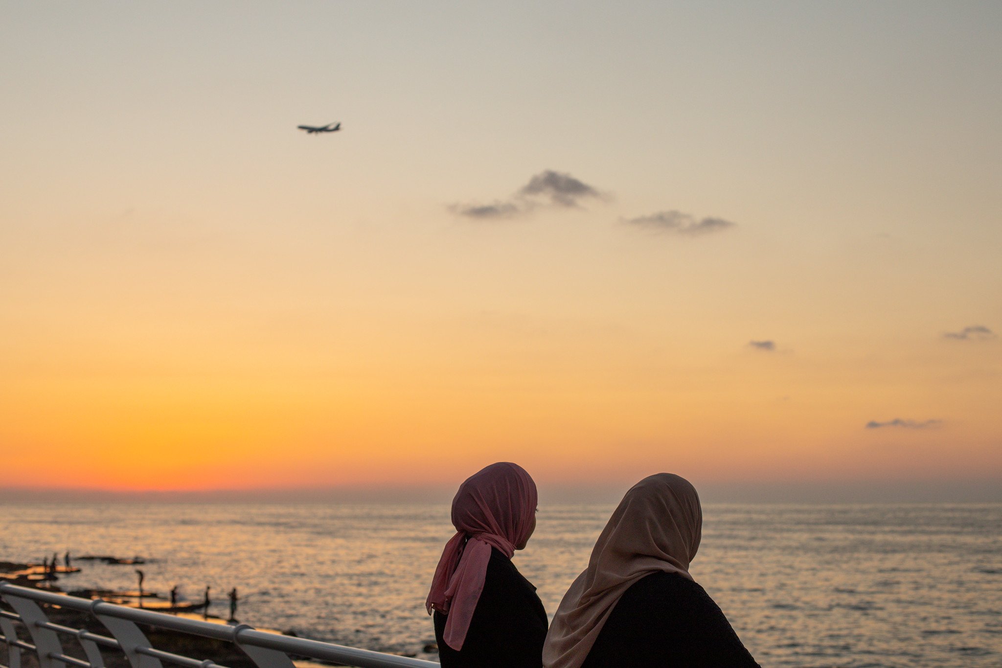 Two local women enjoying the sunset on the Corniche of Beirut.