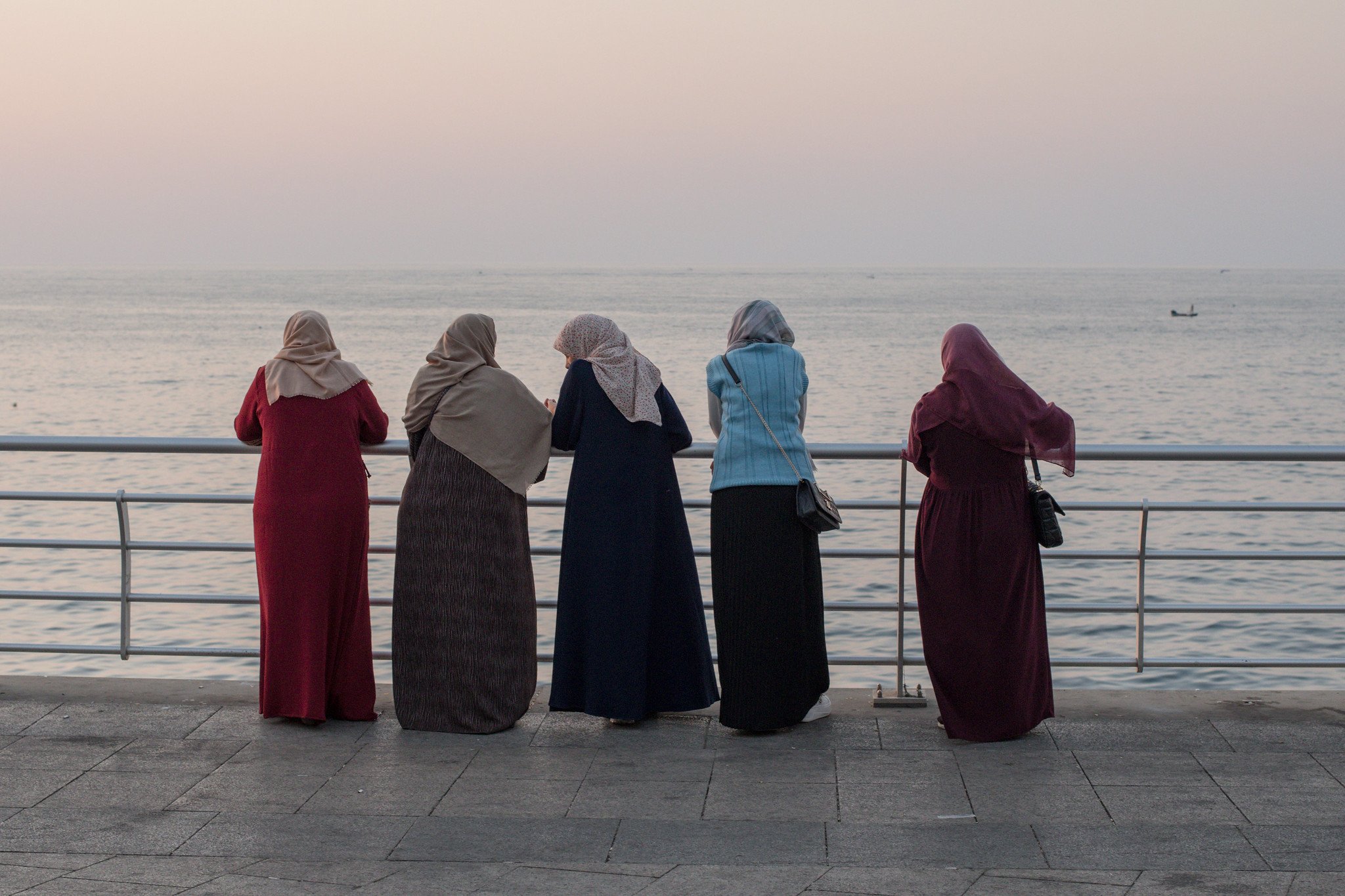 Local women enjoying the sea view on the Corniche of Beirut.