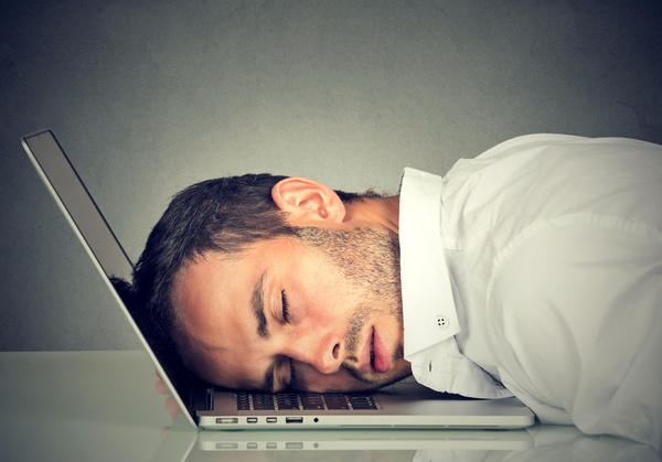 man asleep on computer exhausted.jpg