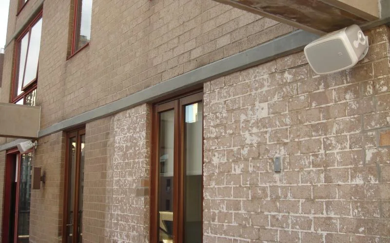 Professionally mounted speakers bring sound outdoors.jpg