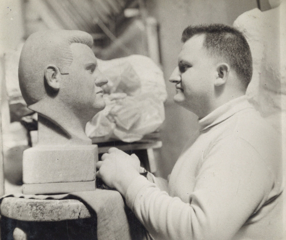 Emil confronts his image in stone carved by fellow ASL student Atillio Fierro (Photo by Atillio Fierro).