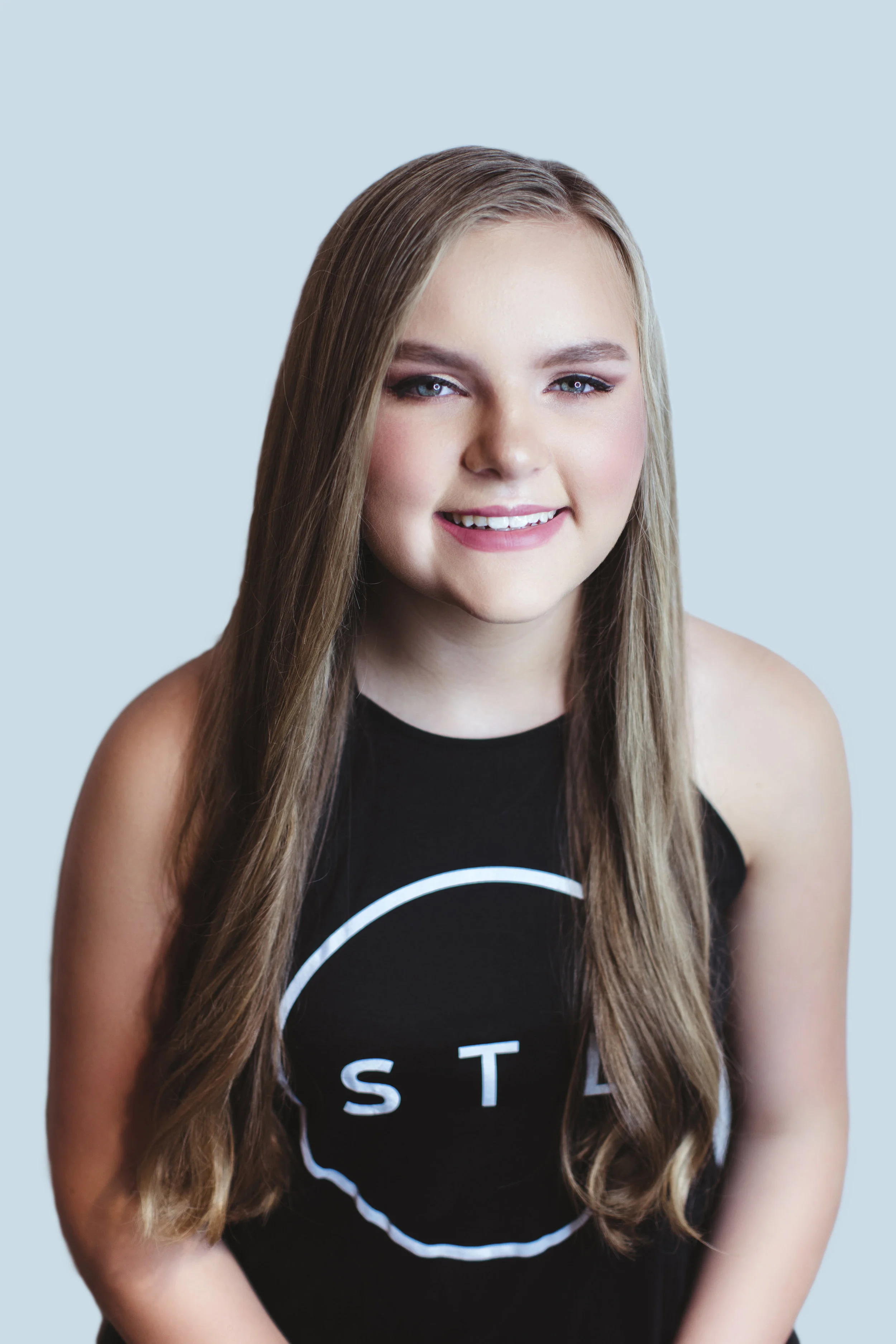 Olivia, a freshman at Villa Duchesne, chose a simple blown out look, a sophisticated style accentuating her beautiful, long hair which Dominic says is most popular right now. Makeup By Rose Turner Hair By Dani Stassi