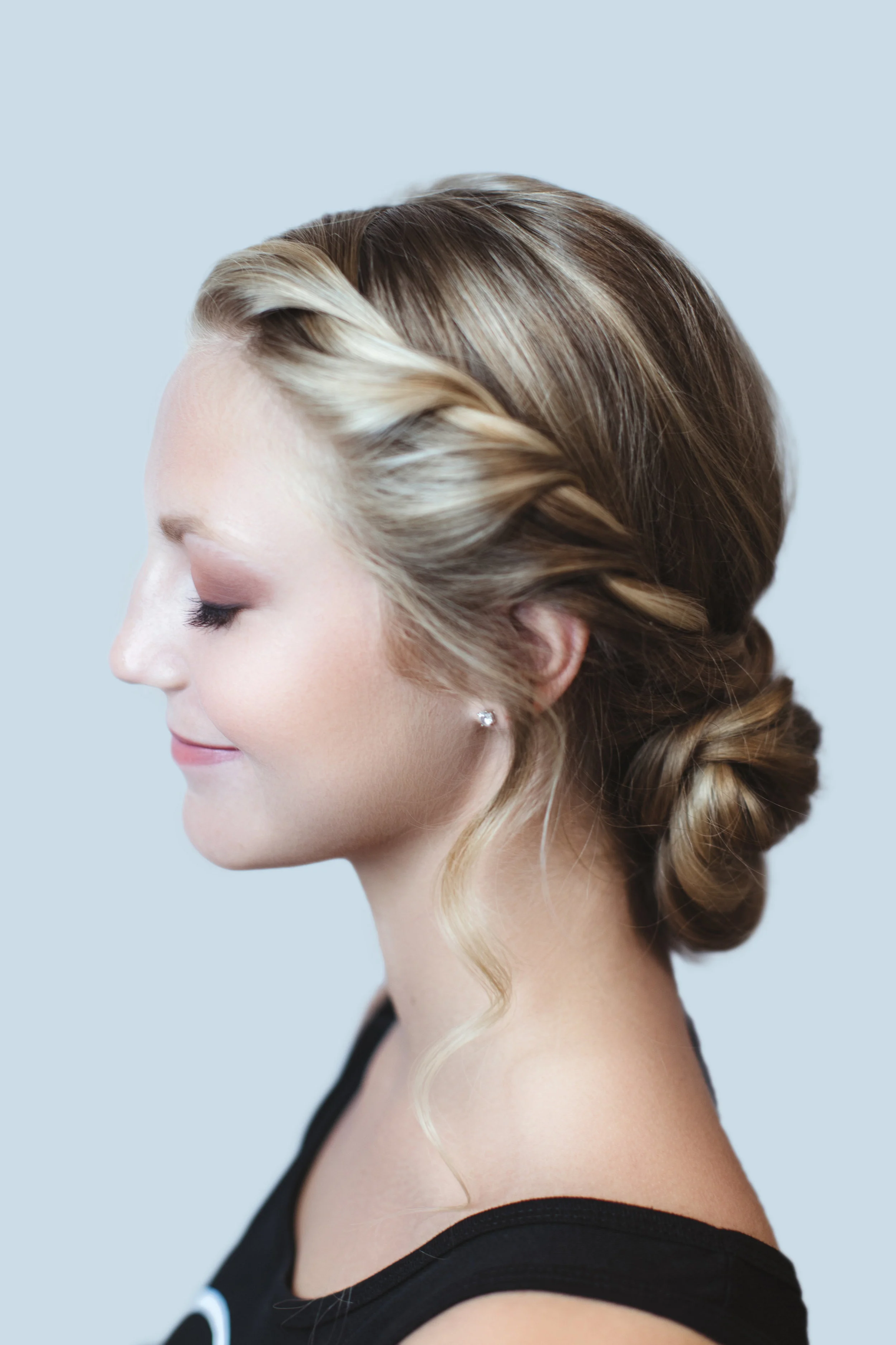 Catherine, a senior at MICDS, was uncomfortable with her first style that featured tighter braids pulled into a ponytail. She asked rather for tresses on the sides that stylist Kamiah Mills pulled forward from an elegantly revised chignon. Makeup By Nikki Clark Hair By Kamiah Mills