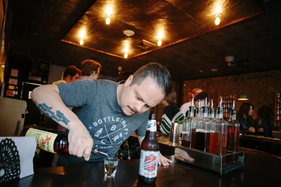 Erick Castro pours up drinks at the Boilermaker. RAMSAY DE GIVE FOR THE WALL STREET JOURNAL