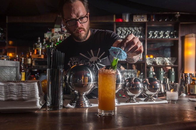 Danny Neff, bar manager at Holiday Cocktail Lounge, puts the finishing touches on a drink.PHOTO: PAUL WAGTOUICZ