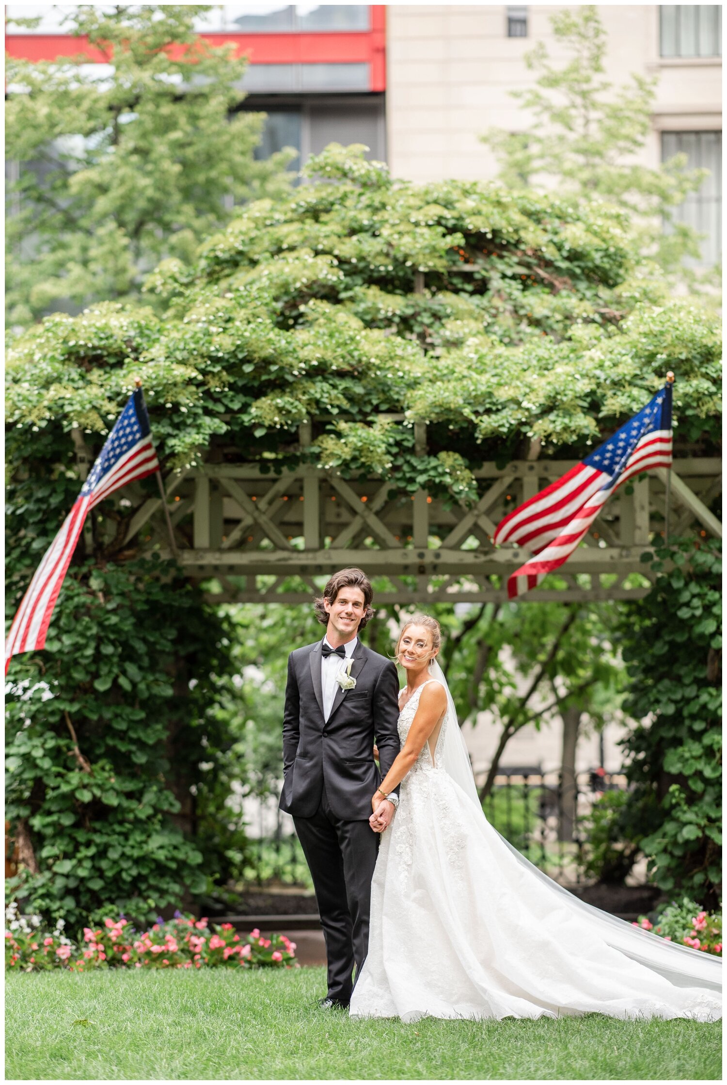 bride and groom standing on lawn at State Room Boston Wedding 