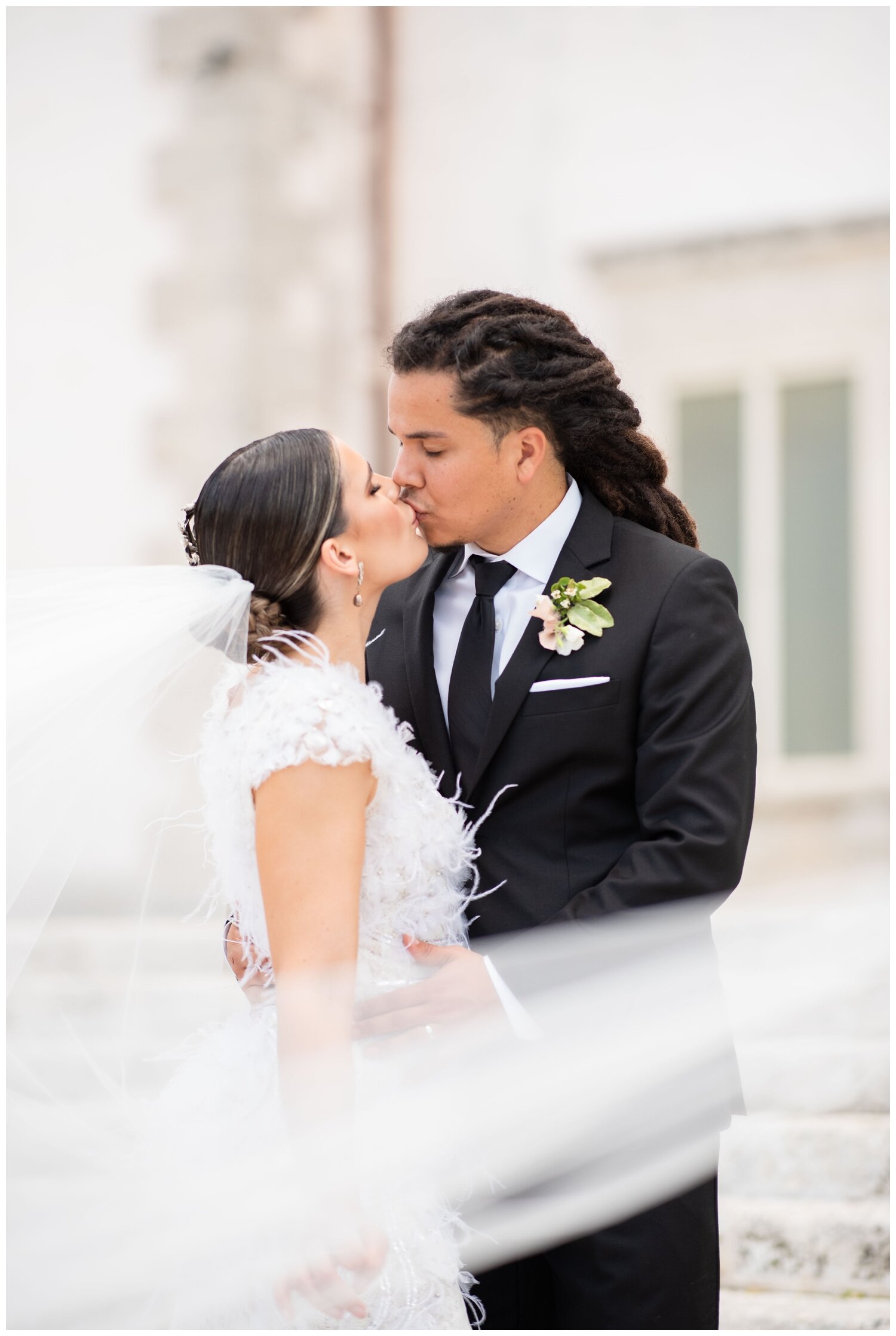 Miami-Wedding-Photographer-bride-groom-kissing-veil-shot.jpg