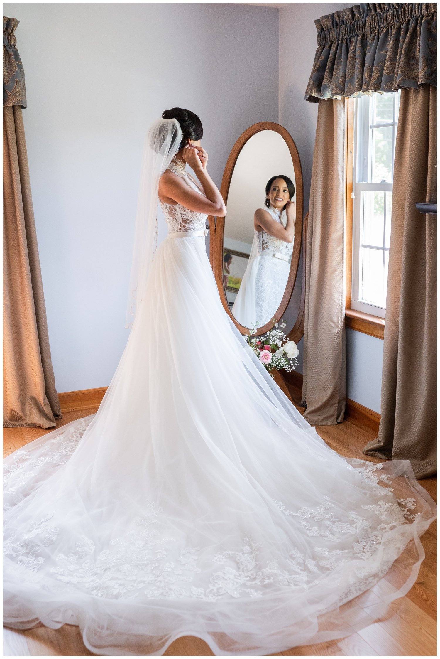 bridal portrait with bride putting on earrings for Fairmont Copley Plaza wedding