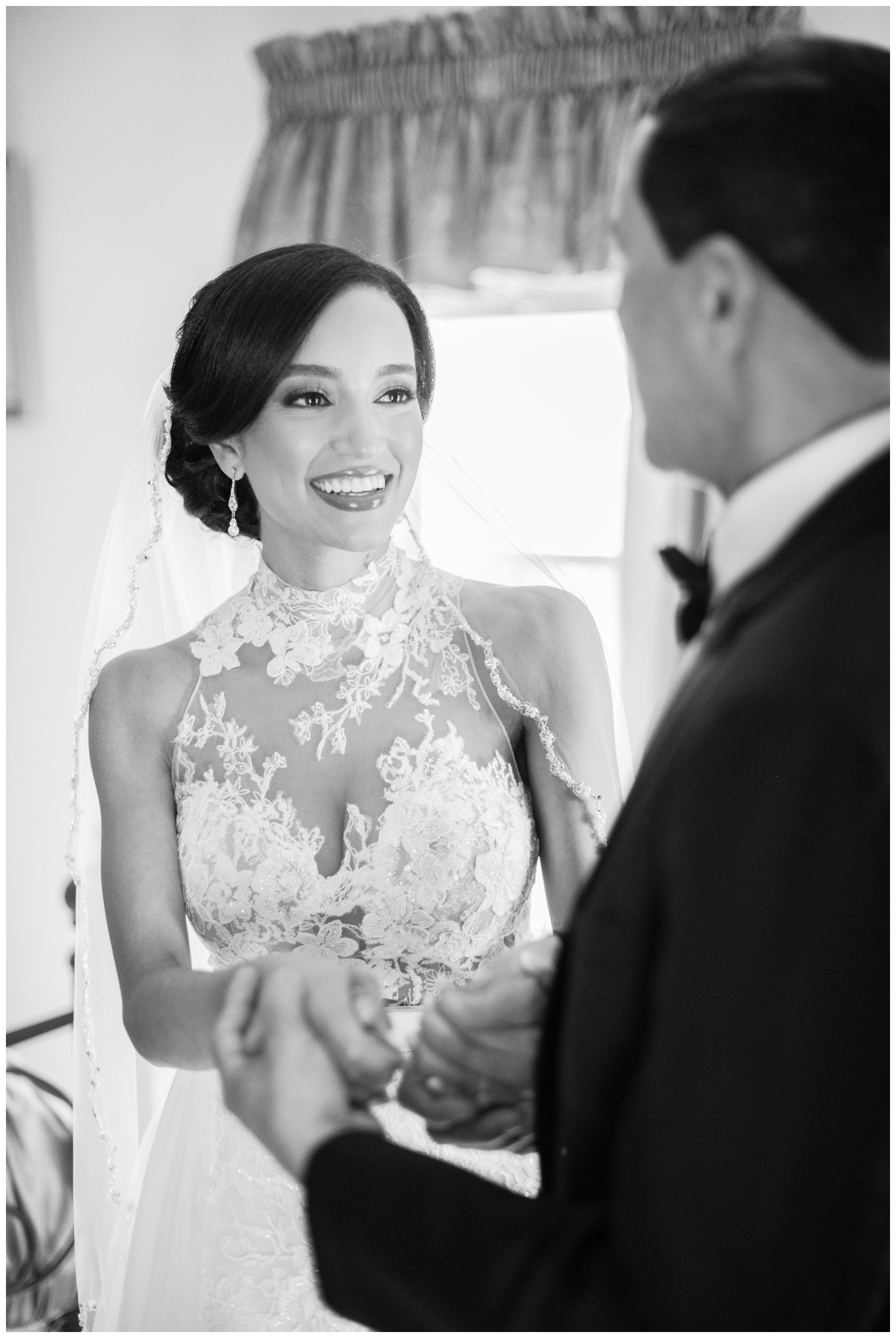 bride smiling at her father during first look 