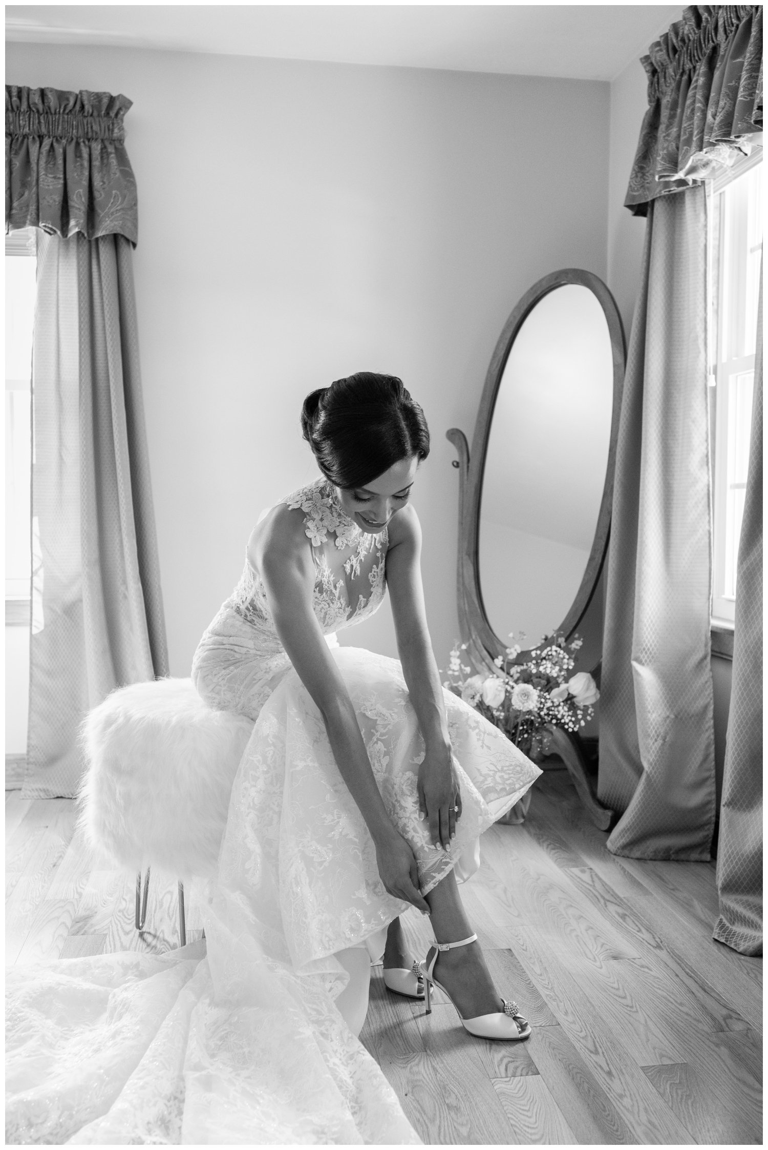 black and white portrait of bride putting on wedding heels Fairmont Copley Plaza