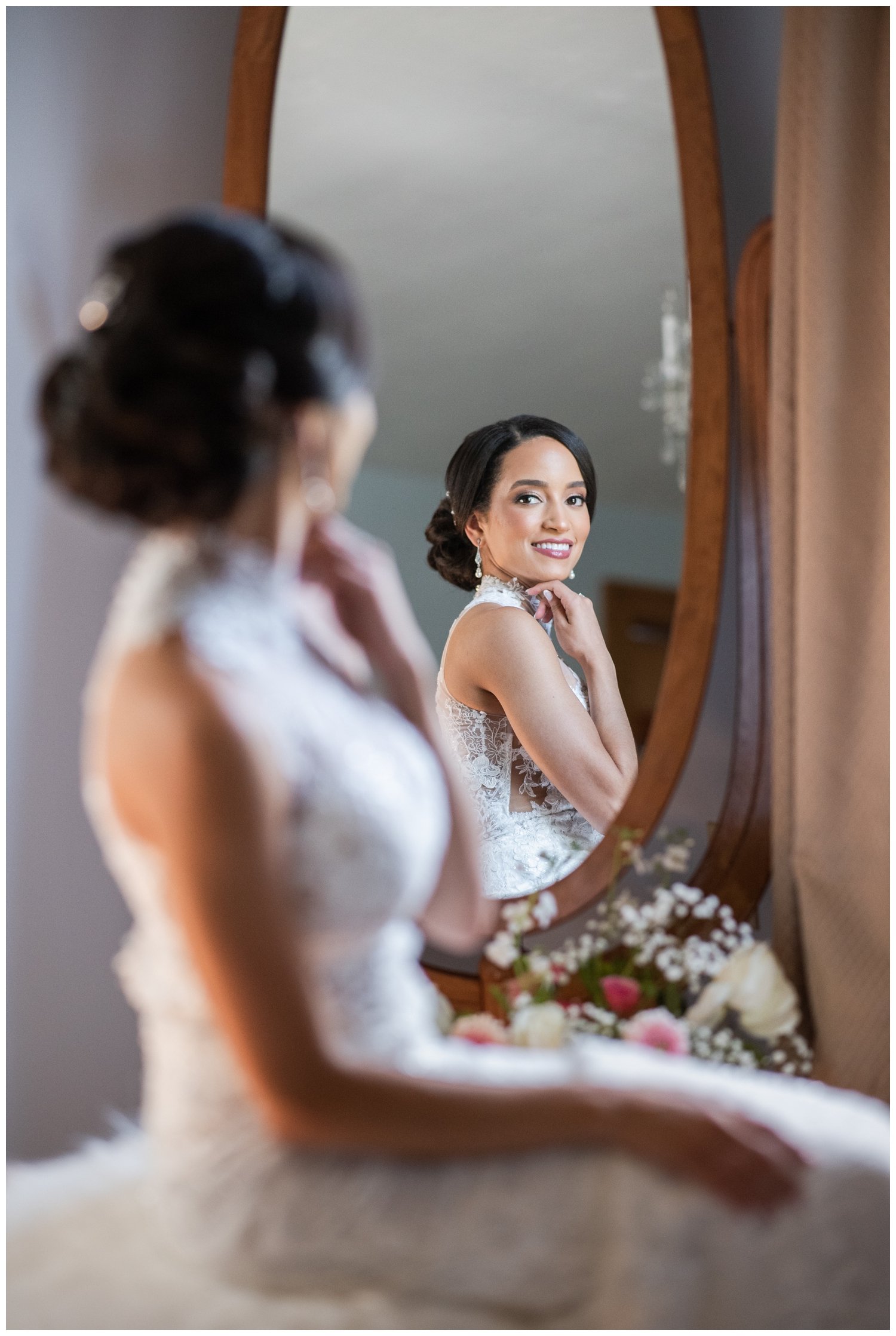 bridal portrait with bride seated looking in a mirror