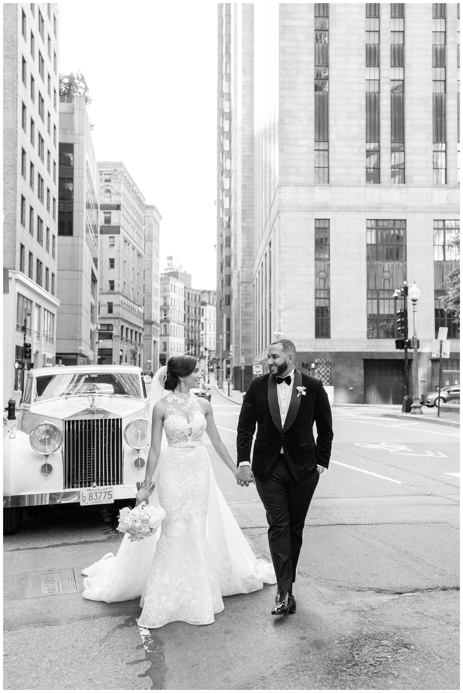 black and white photo of couple walking in Boston streets for Fairmont Copley Plaza wedding