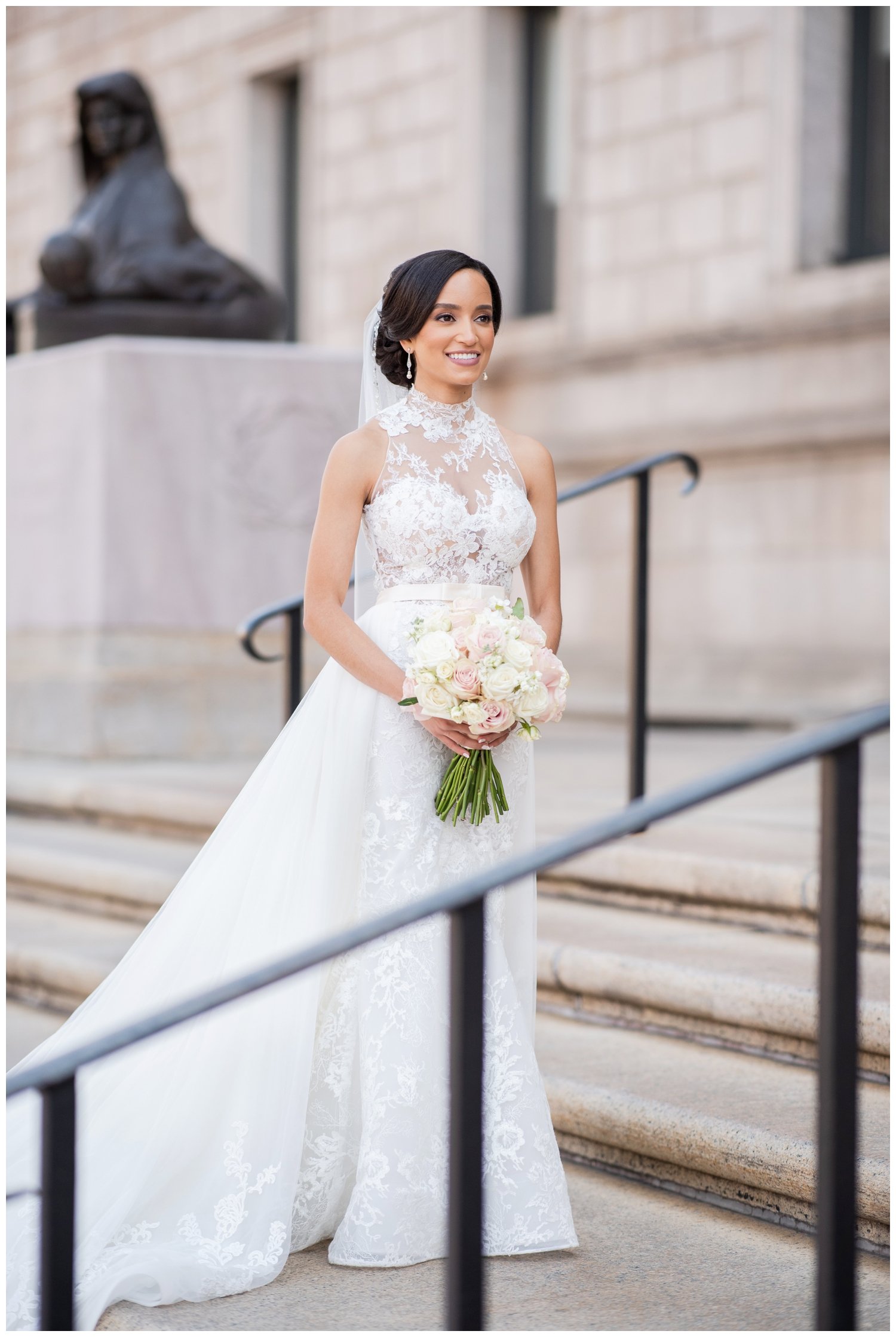 bride standing on steps of Boston Public Library