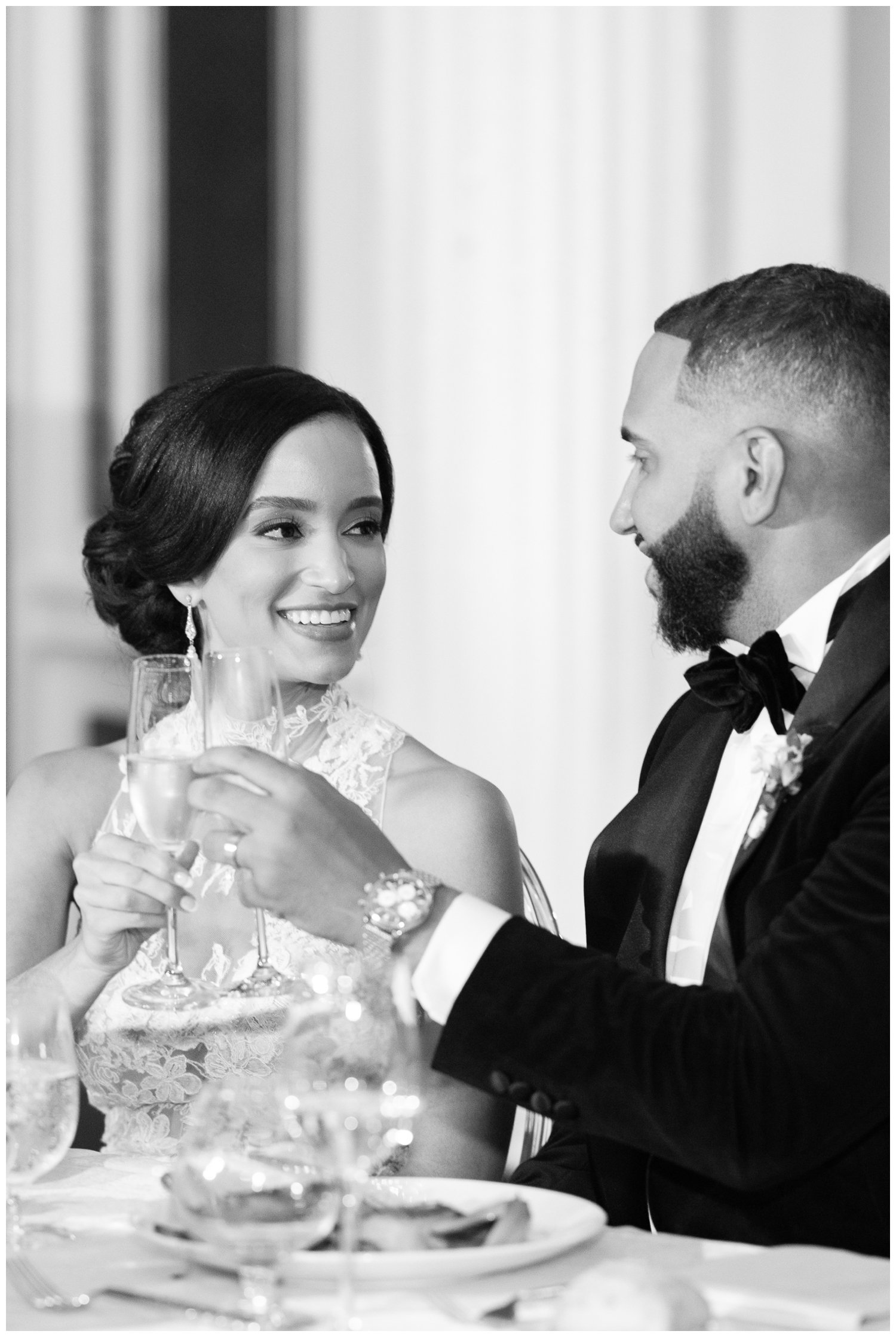 black and white portrait of bride and groom toasting at Fairmont Copley Plaza wedding reception