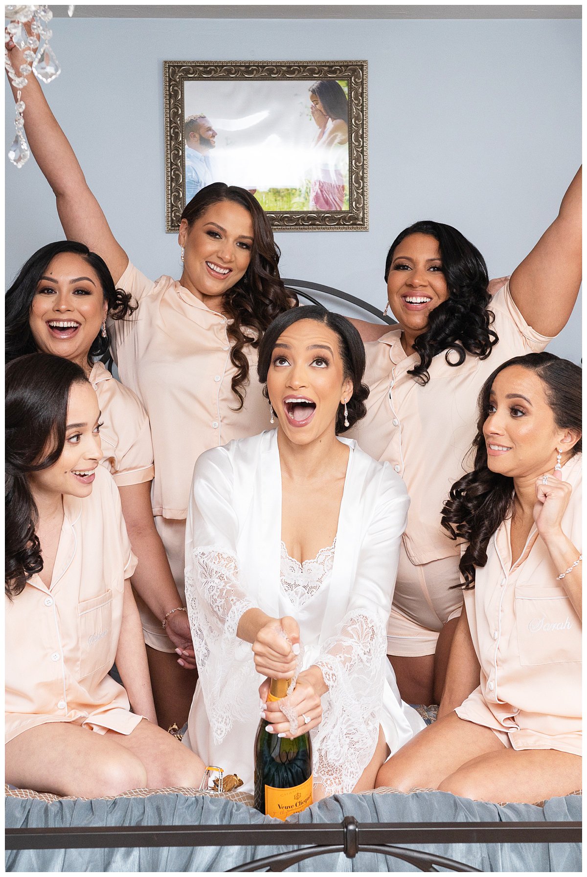 bridesmaids matching robe and bride with champagne Fairmont Copley Plaza wedding