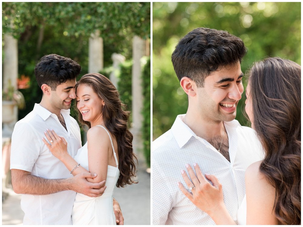 engaged couple in all white embracing and smiling during Vizcaya Museum engagement photos in Miami, Florida