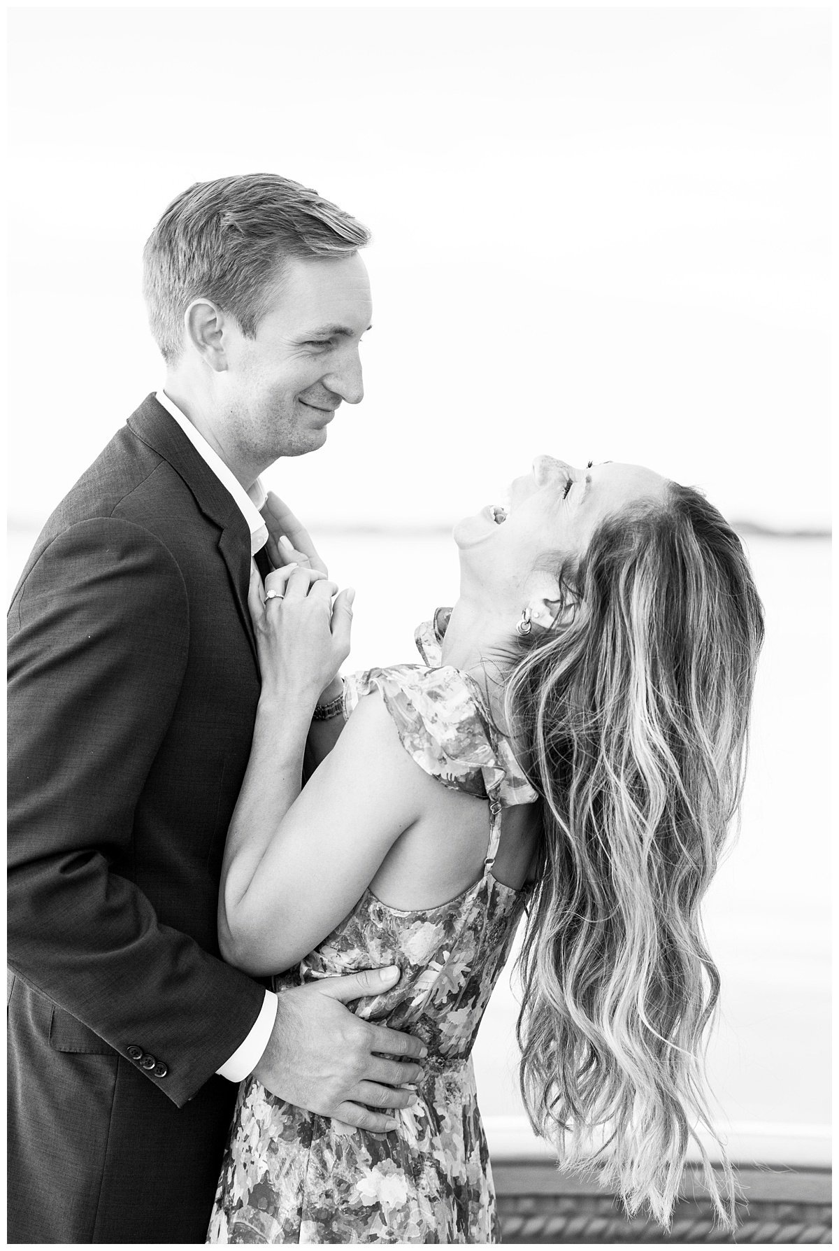 black and white image of couple laughing 