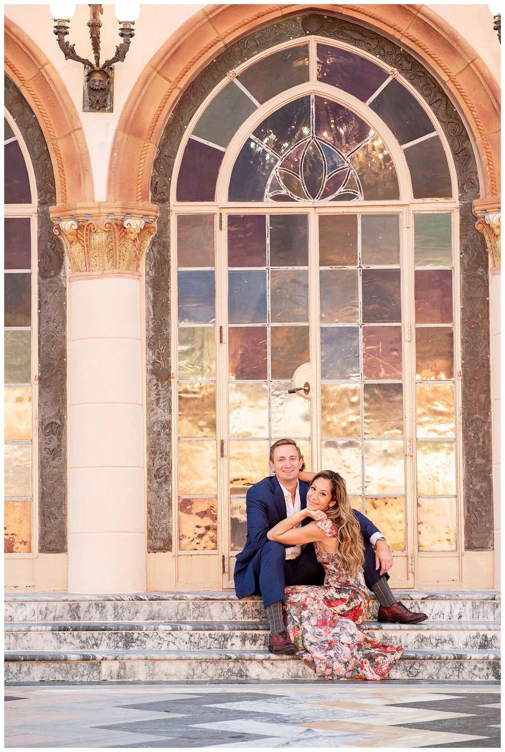 engaged couple sitting on steps at Ringling Museum for Miami wedding photographer