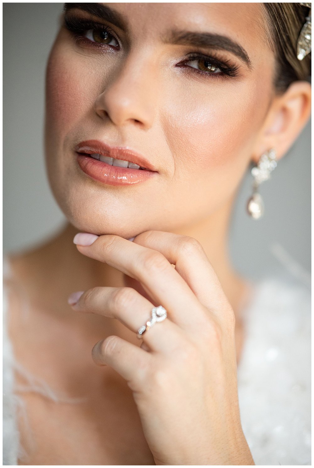 close up portrait of bride with hand on chin