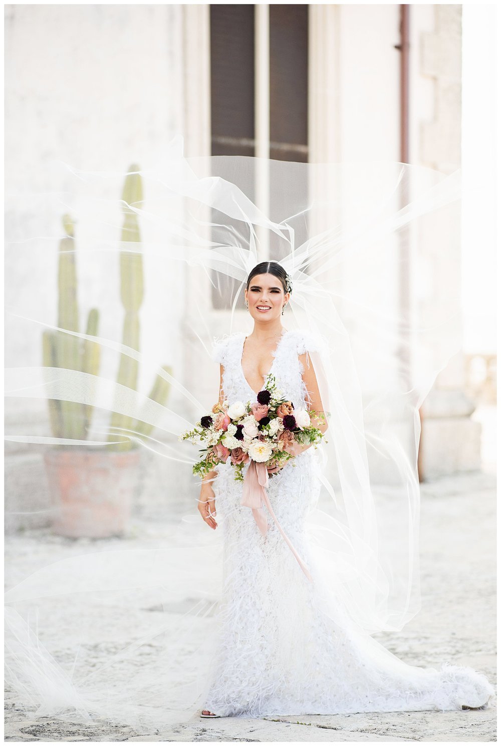 bridal portrait with veil swoop on steps at Vizcaya Museum and Gardens in Miami, Florida