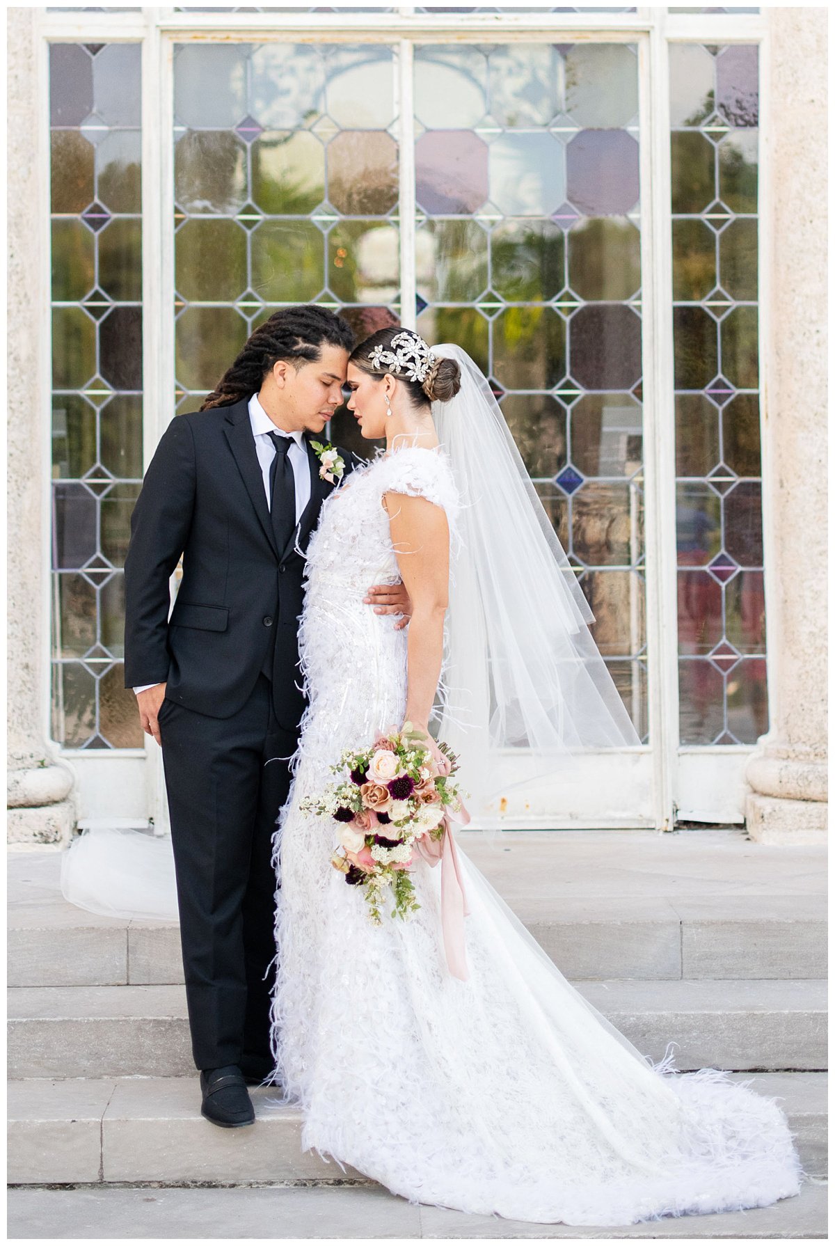 bride and groom nose to nose portrait outside Vizcaya Museum and Gardens in Miami, Florida