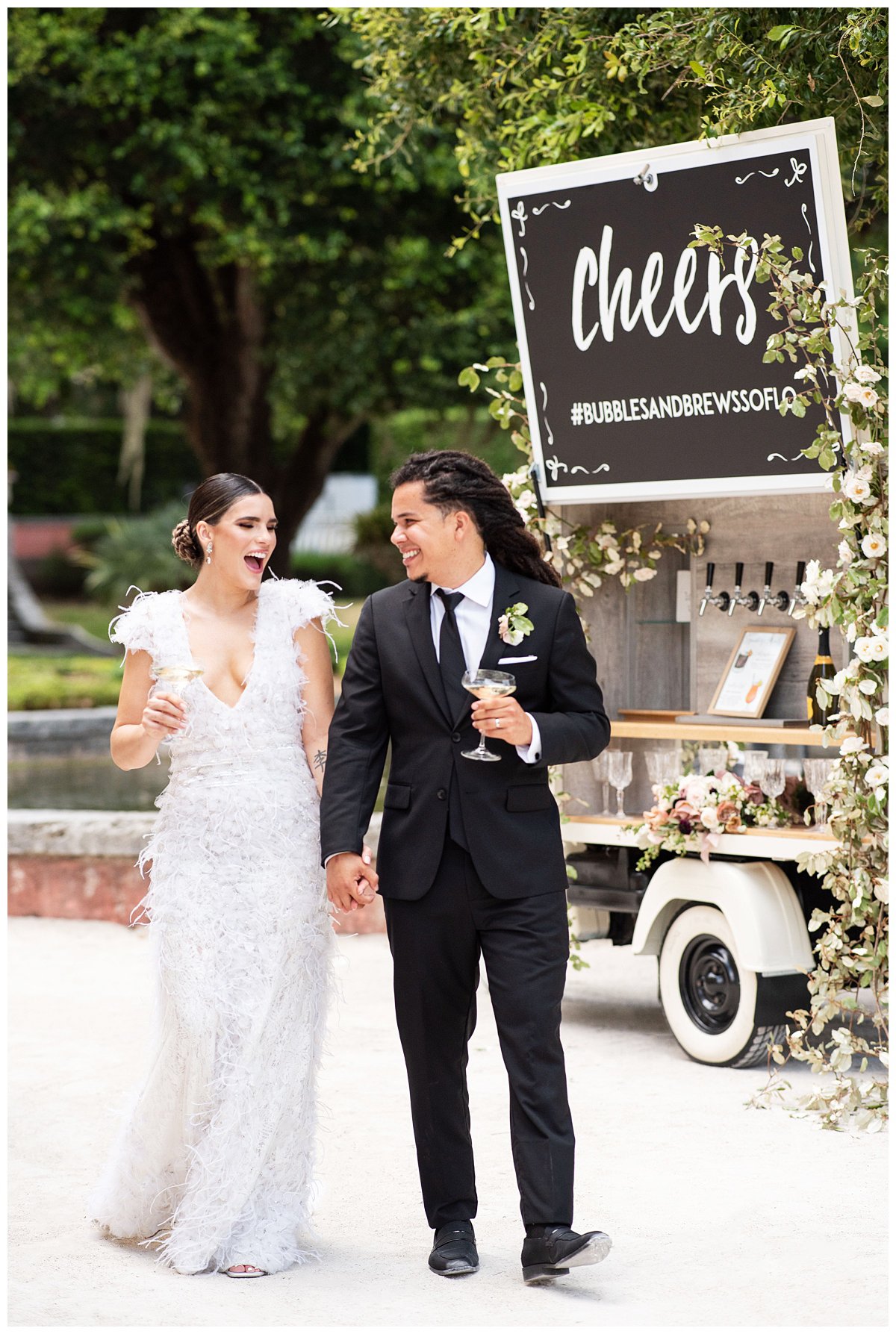 bride and groom walking in front of bar cart at elopement Miami wedding photographer