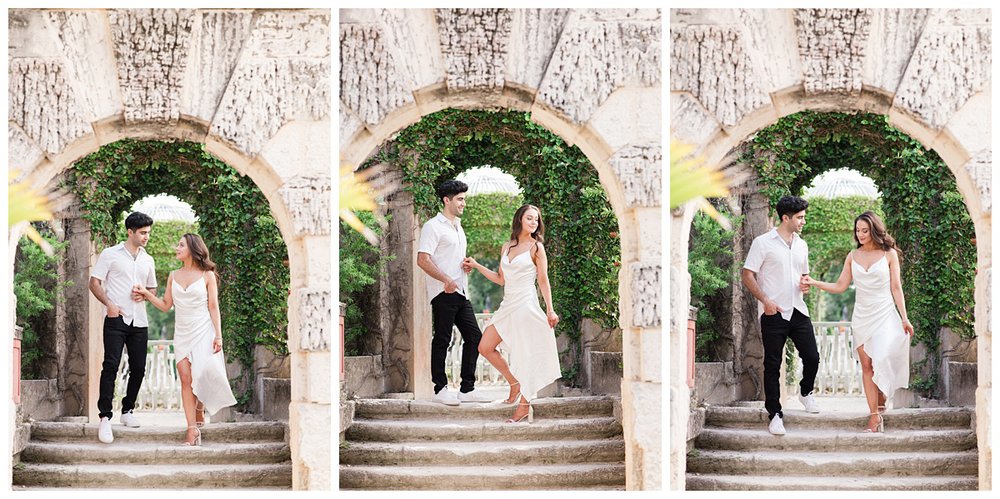 engaged couple dancing under an archway for Vizcaya Museum engagement photos