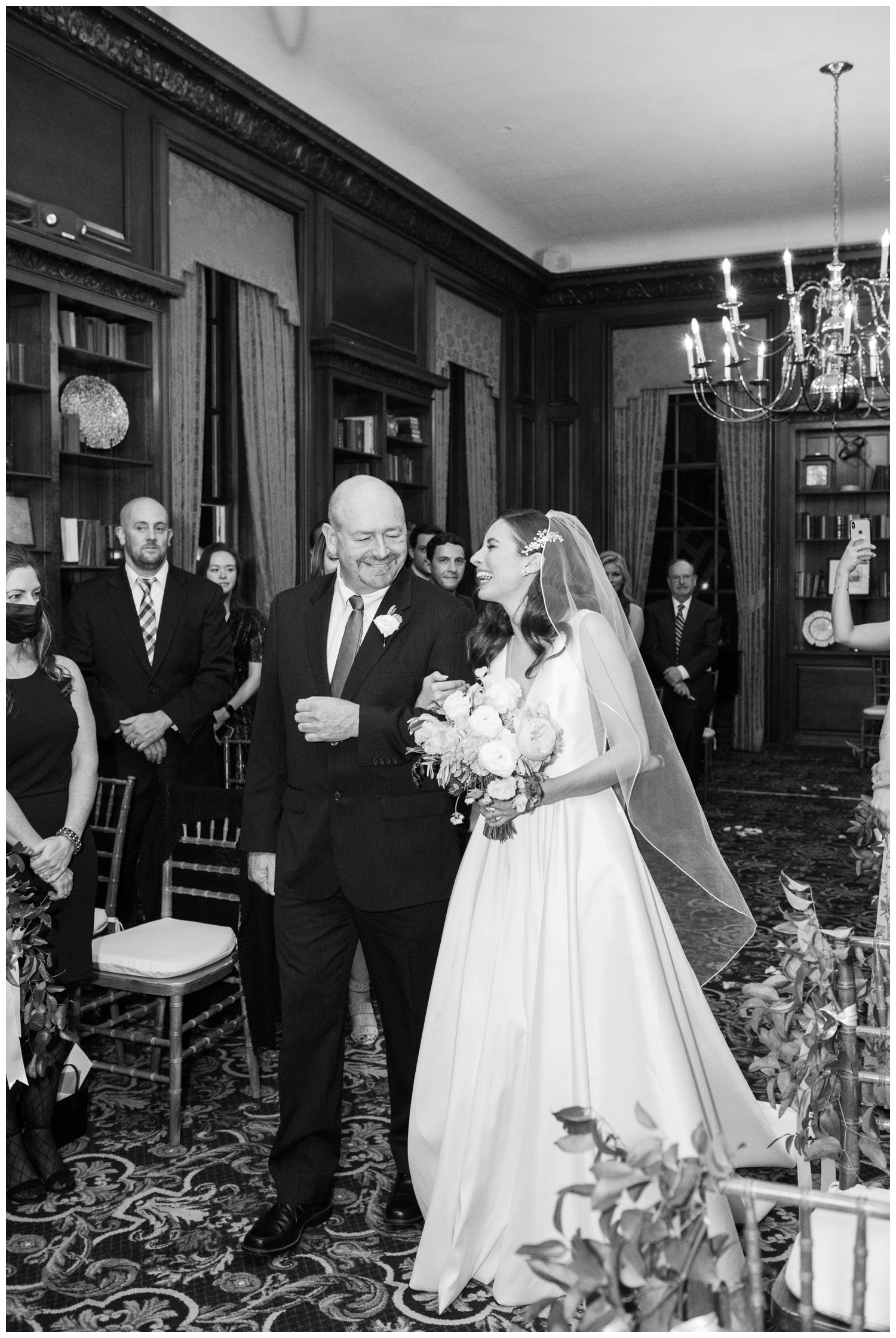 father of bride escorting bride down the aisle inside Hampshire House Boston wedding photographer