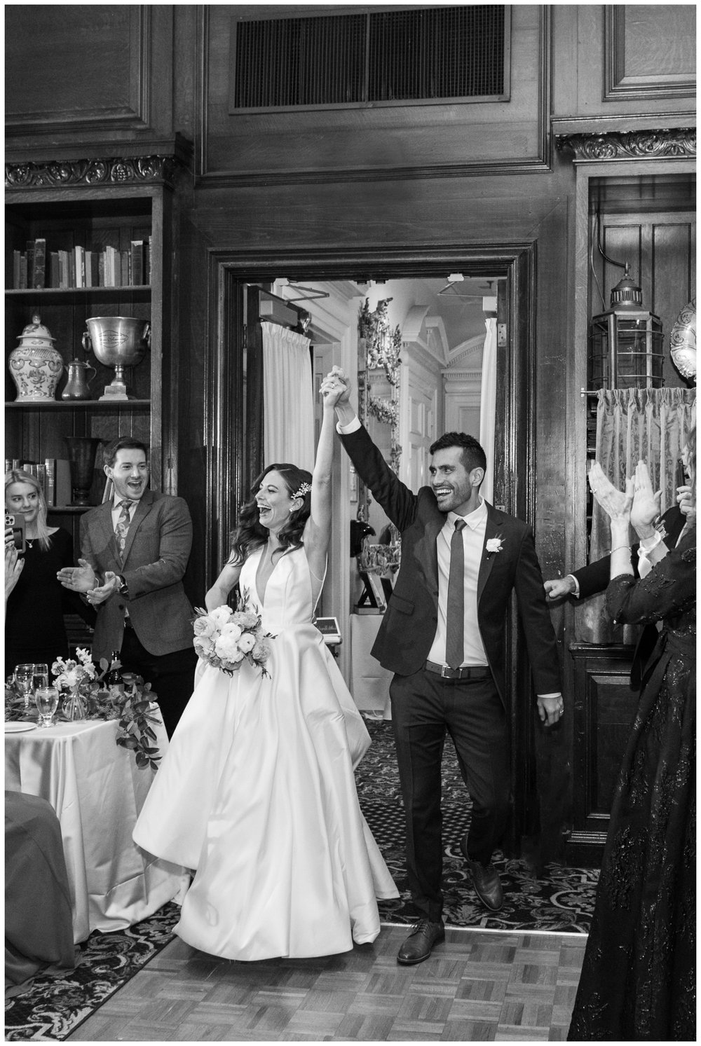bride and groom entering reception The Hampshire House Boston wedding photographer