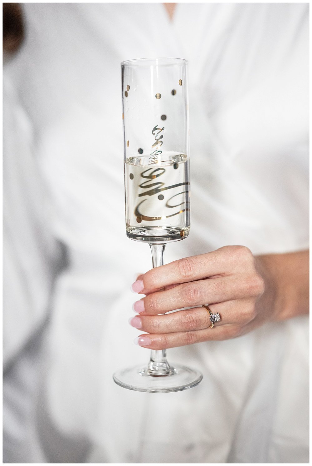 detailed image of bride's hand holding champagne glass Boston wedding photographer