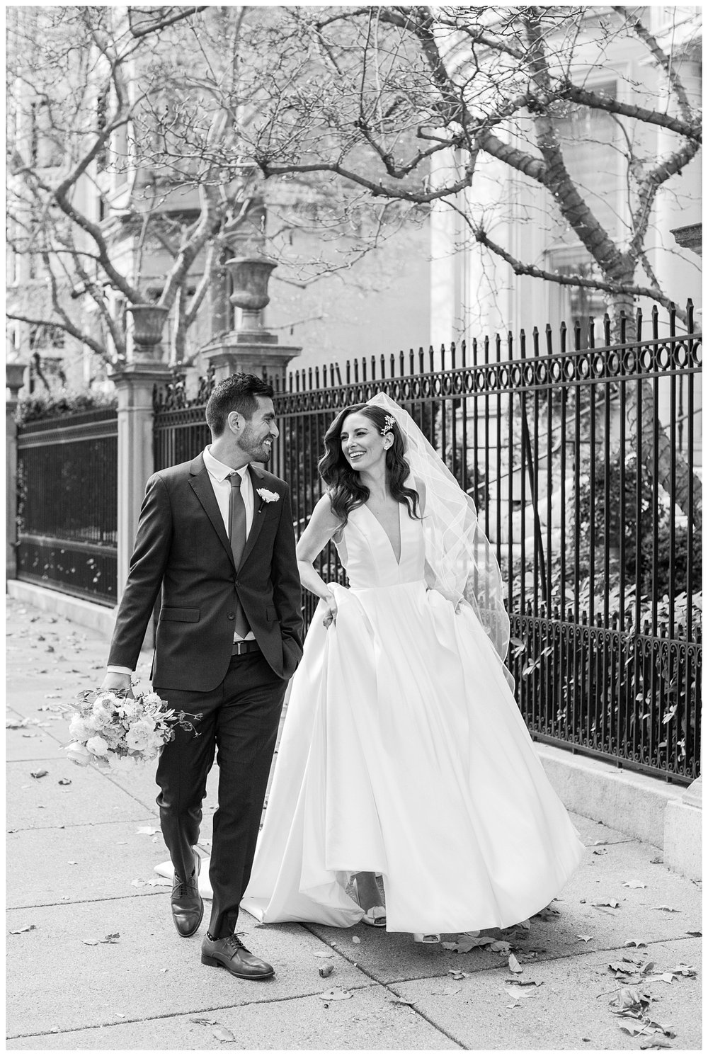 bride and groom holding hands walking Boston city street