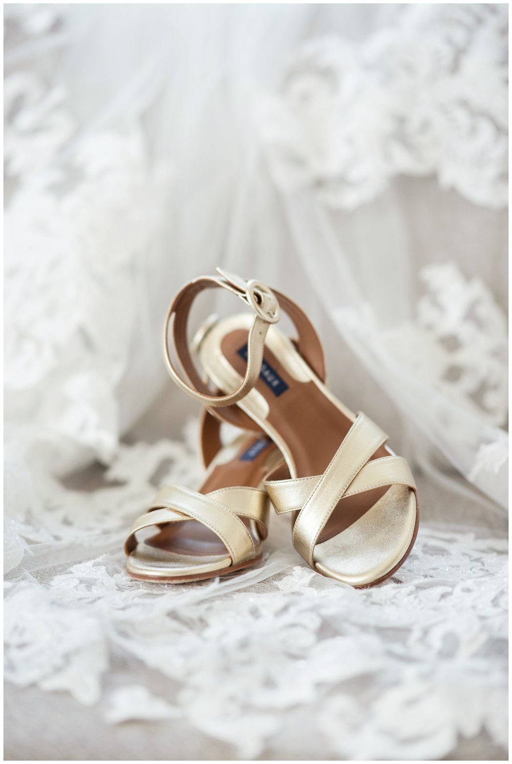 cream wedding shoes on lace veil