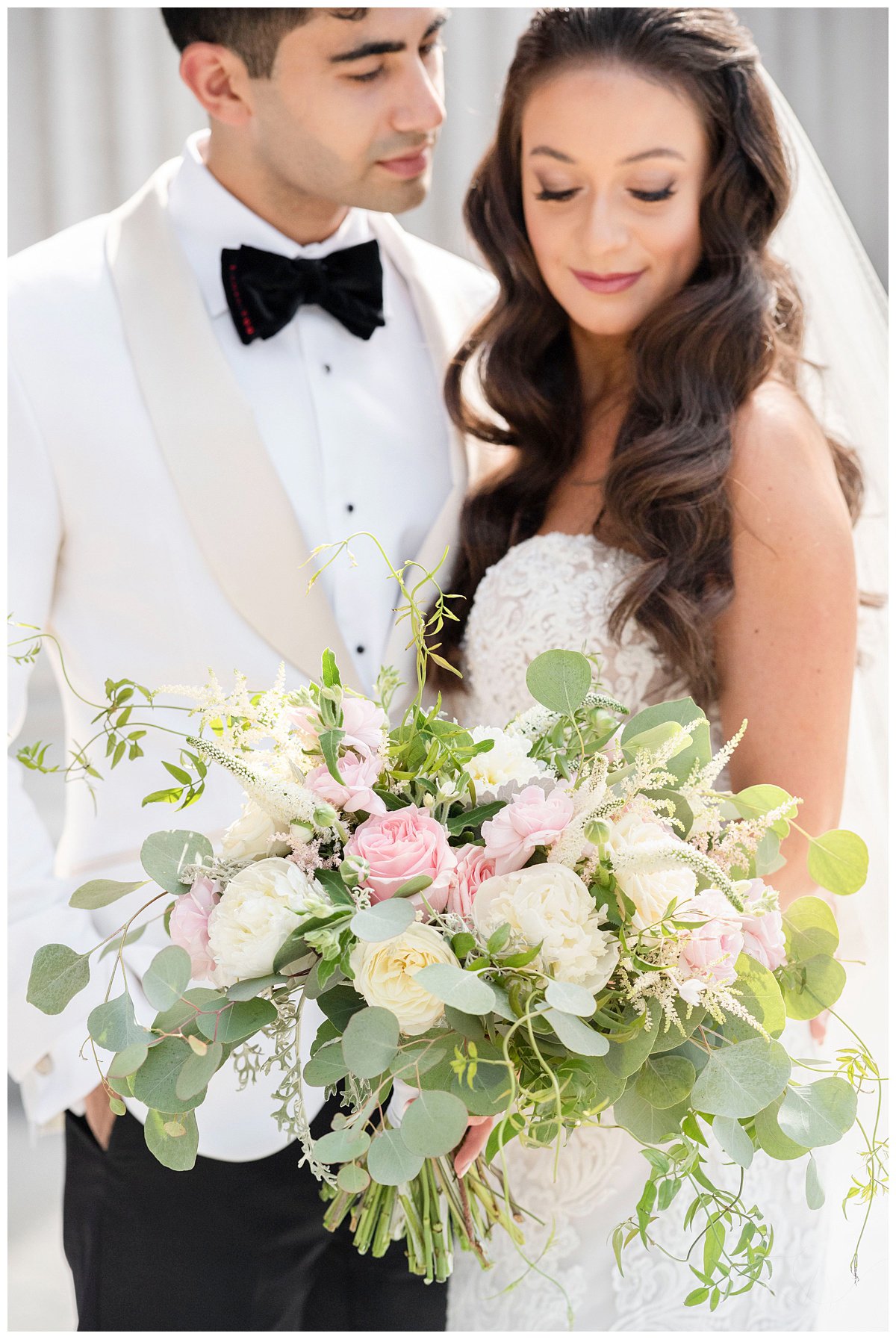 closeup portrait bride and groom with pink and white bouquet Granite Links wedding