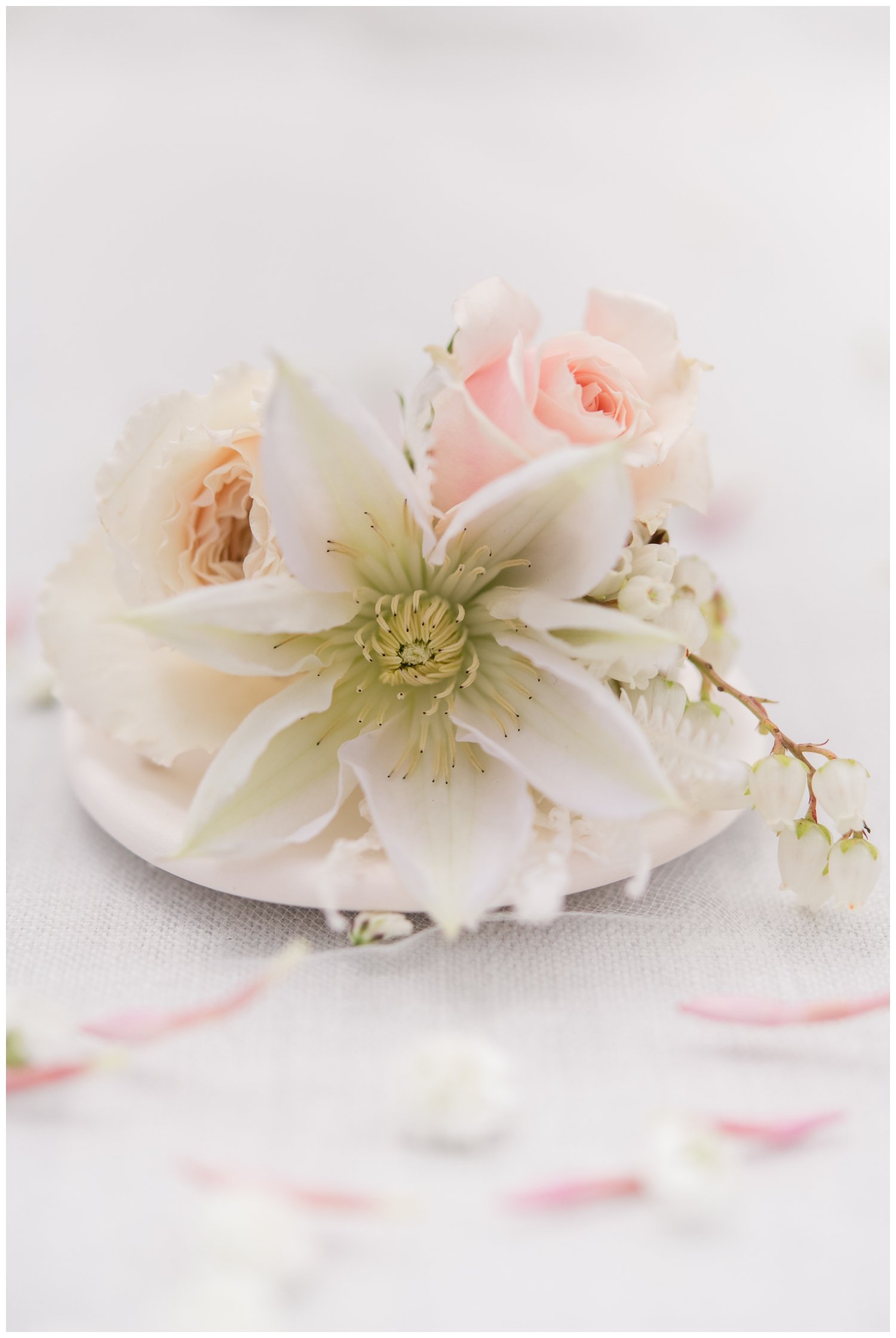 white floral petal in white ceramic dish