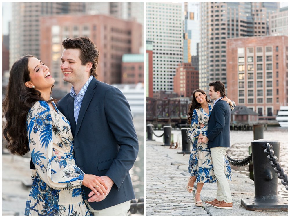 engaged couple laughing by waterfront at Boston Seaport engagement session