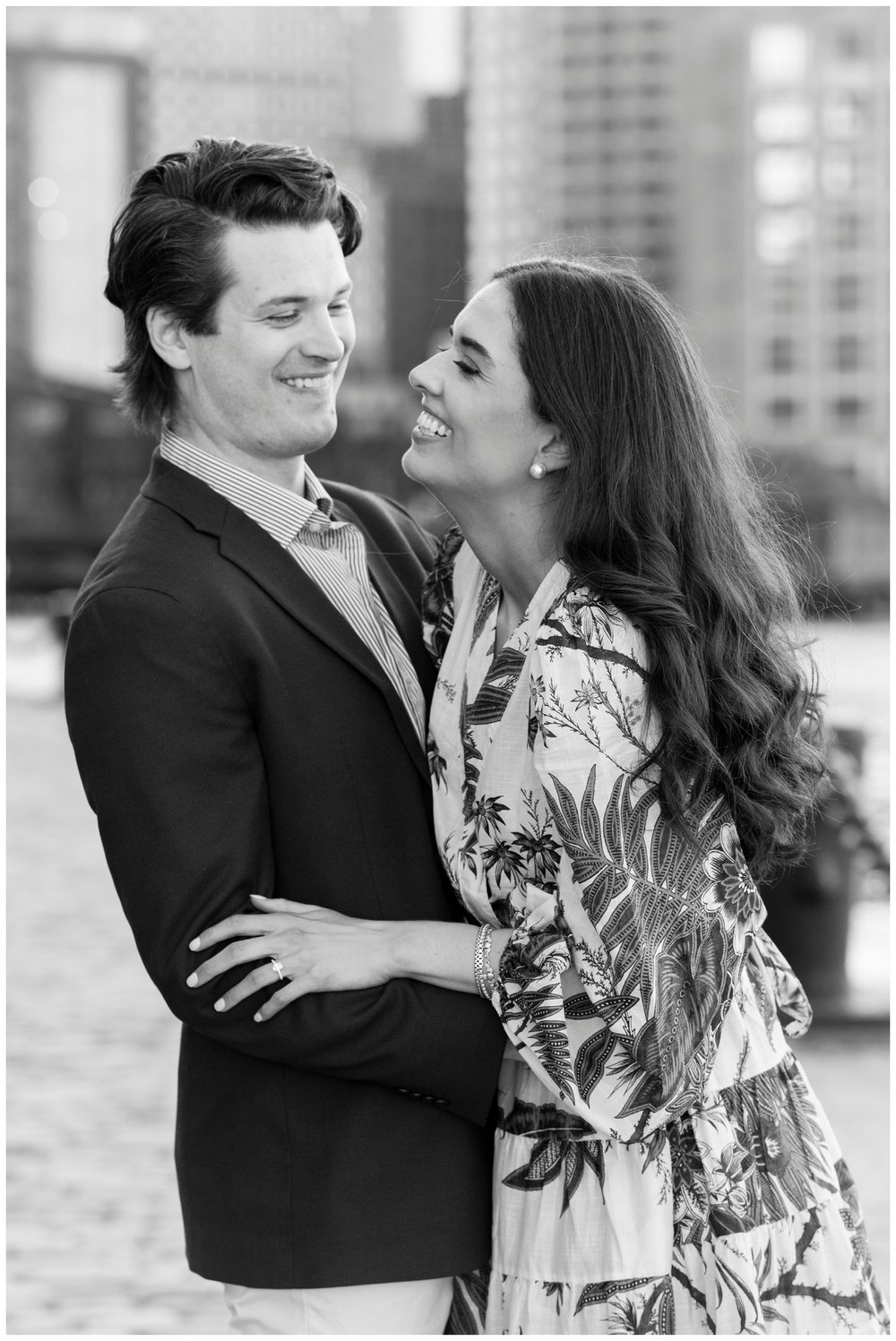 black and white portrait of couple laughing
