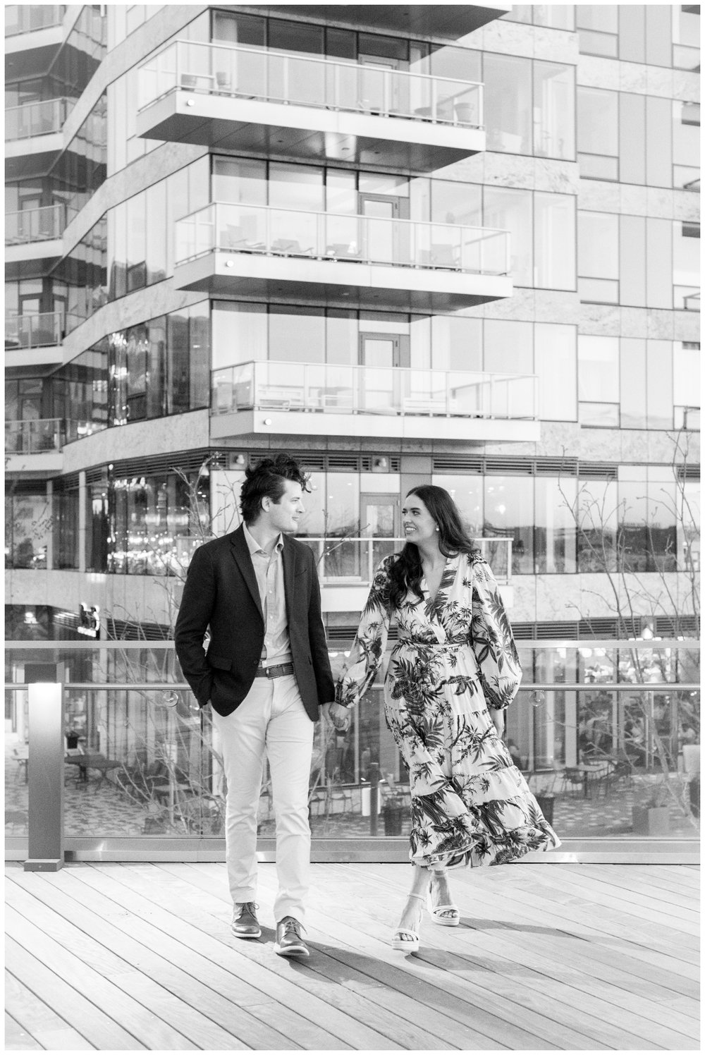 Boston-Seaport-Engagement-Session-couple-walking-black-white-photo.jpg