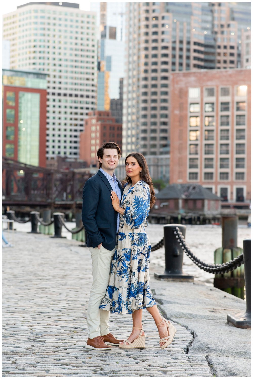Boston Seaport with couple standing and looking at camera