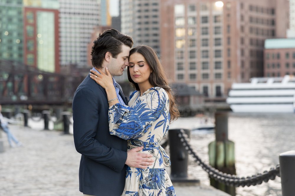 couple nuzzling for Boston Seaport engagement session