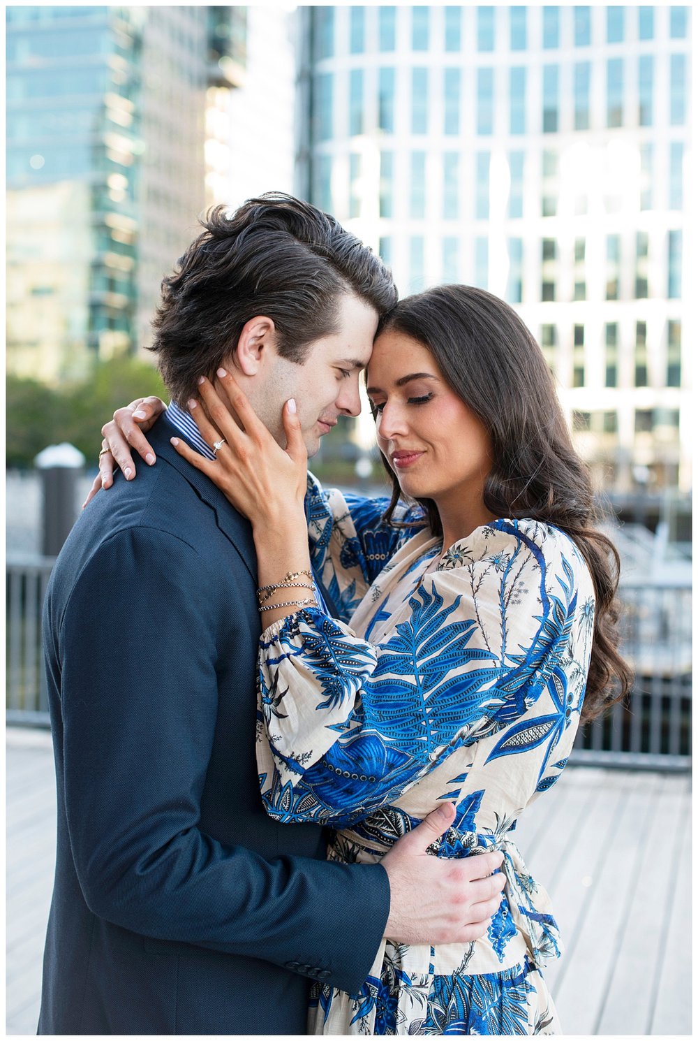 Boston Seaport engagement session portrait of couple touching foreheads