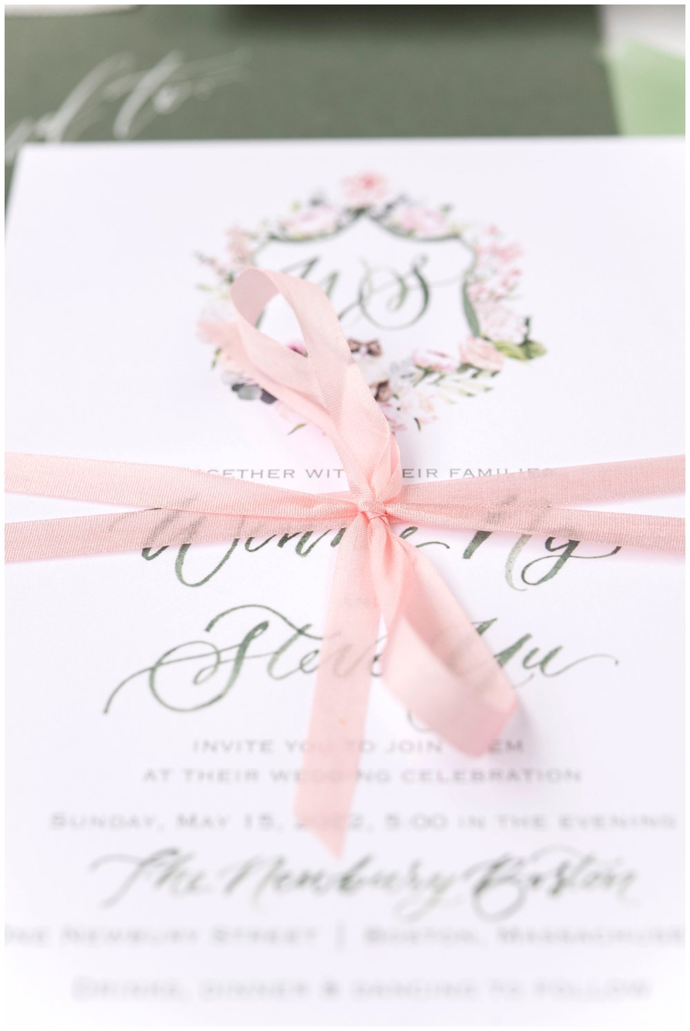white invitation suite with pink bow