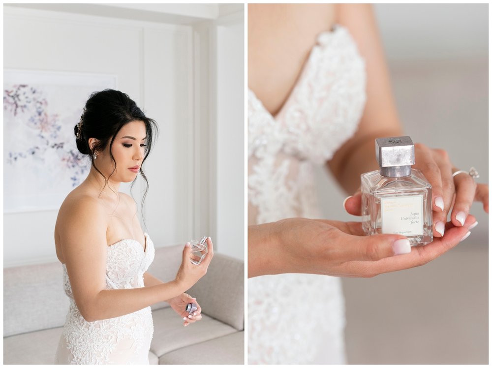 bride in wedding gown spraying on perfume and holding the bottle