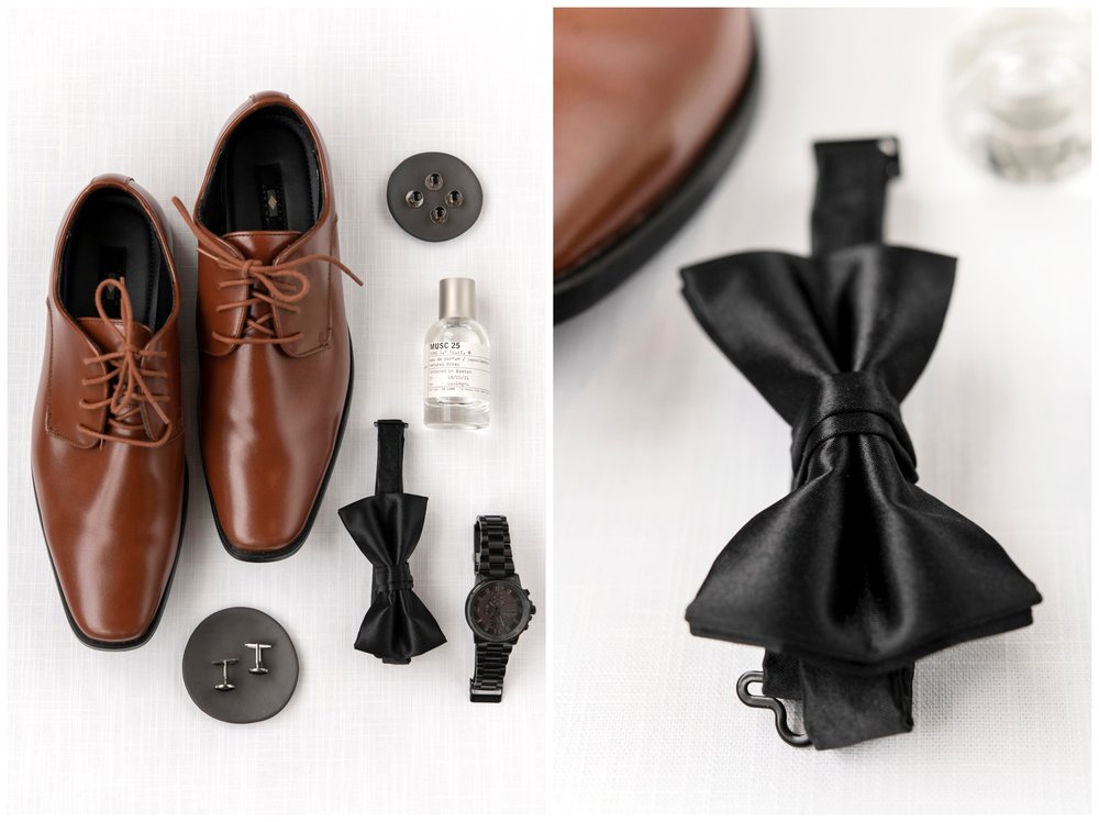 groom detail flatlay with shoes, black bow tie, cologne bottle