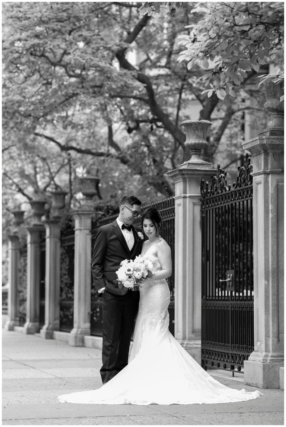 black and white image of bride and groom nuzzling
