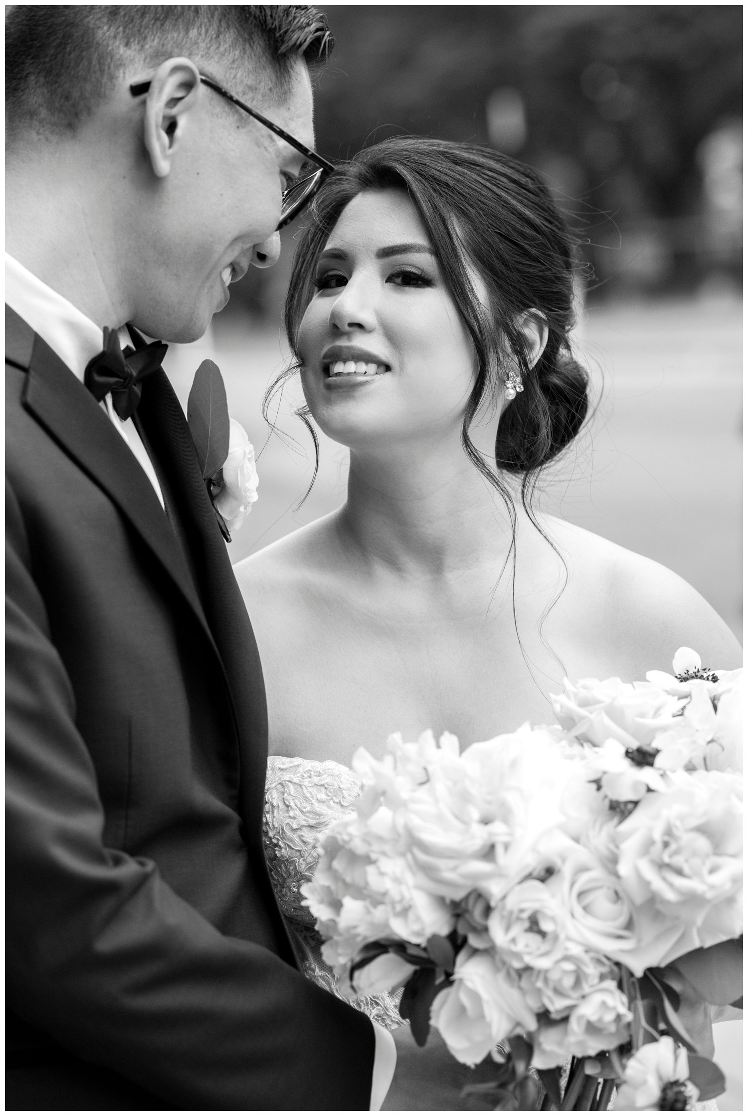 bride and groom laughing portrait in black and white The Newbury Hotel wedding