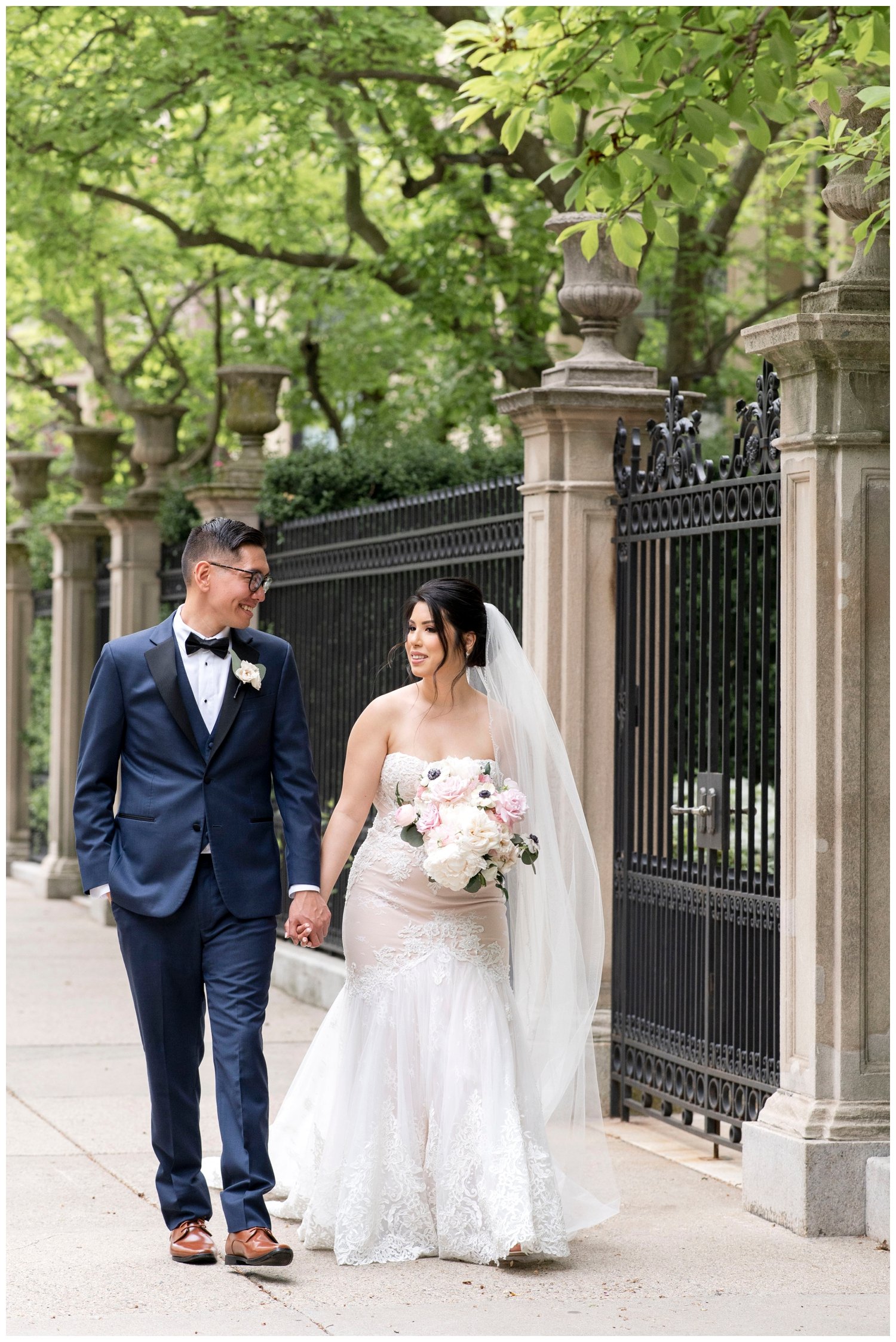 bride and groom portrait holding hands walking
