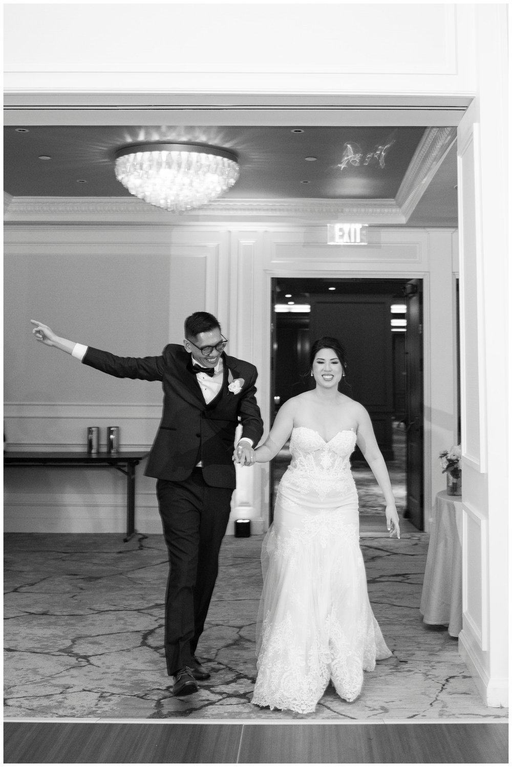 black and white image of bride and groom enteringThe Newbury Hotel  wedding reception