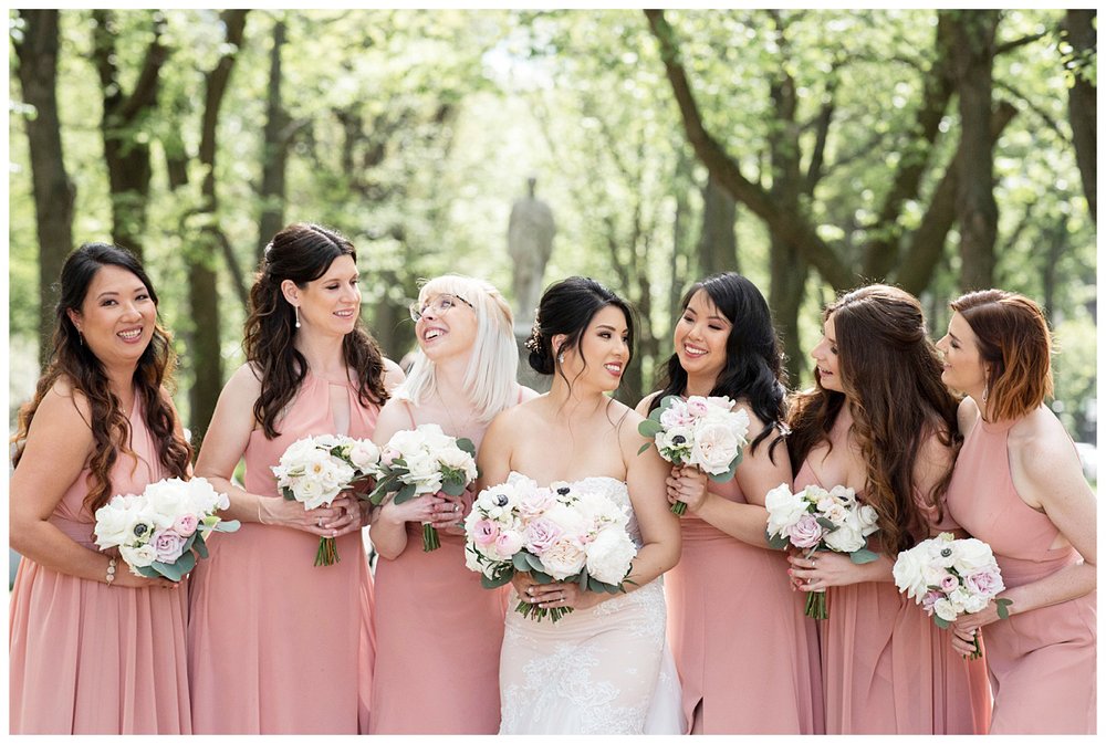 bride and bridesmaid in blush dresses outdoor portrait