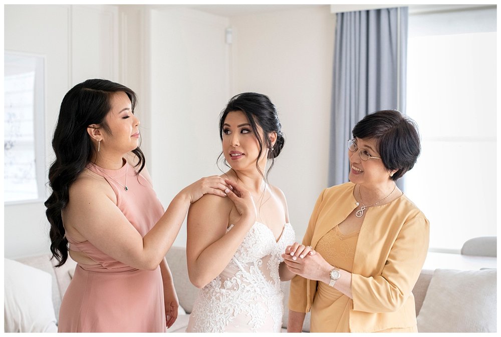 bride getting ready portrait with mom and maid of honor 