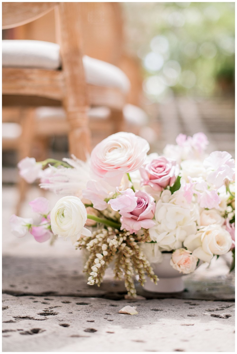 detailed image of blush florals ceremony space by chairs